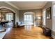 Bright living room with hardwood floors, arched doorways, and several windows at 5768 Cavanaugh Dr, Raleigh, NC 27614