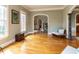 Spacious living room with hardwood floors, neutral walls, and comfortable seating near large windows at 5768 Cavanaugh Dr, Raleigh, NC 27614