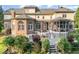 Back of home featuring a screened porch, stone patio and backyard entertaining space at 5768 Cavanaugh Dr, Raleigh, NC 27614