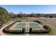 Outdoor tennis courts in a well-maintained neighborhood with beautiful landscaping at 5768 Cavanaugh Dr, Raleigh, NC 27614