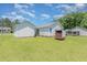 Backyard of home with a detached garage and trailer at 6 N Carolina Ave, Benson, NC 27504