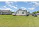 Backyard view showing garage, trailer, and the back of the home at 6 N Carolina Ave, Benson, NC 27504