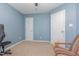 Bedroom view showcases blue walls and two doors leading to closets and or bathrooms at 6 N Carolina Ave, Benson, NC 27504