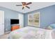 Bedroom with carpet, ceiling fan, and a bright window at 6 N Carolina Ave, Benson, NC 27504