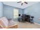 Bedroom features a ceiling fan, window and versatile futon for relaxing or accommodating guests at 6 N Carolina Ave, Benson, NC 27504