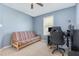 Bedroom has a ceiling fan, natural light from the window and a great space for a study area at 6 N Carolina Ave, Benson, NC 27504