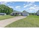 Inviting one-story home featuring an attached garage, complemented by a well-maintained lawn at 6 N Carolina Ave, Benson, NC 27504
