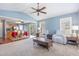 Open living space with a view of the dining area, complete with cozy seating and ample natural light at 6 N Carolina Ave, Benson, NC 27504