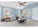 Bright living room featuring a vaulted ceiling, neutral carpet, and cozy seating arrangement at 6 N Carolina Ave, Benson, NC 27504