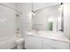 Bright bathroom with shower-tub combo, floating vanity and large mirror at 600 S Duke St # 24, Durham, NC 27701