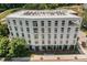 The building has multiple windows, a rooftop deck, and is surrounded by greenery and sidewalks at 600 S Duke St # 24, Durham, NC 27701