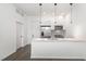 Contemporary kitchen featuring stainless steel appliances, white cabinetry, and a large kitchen island at 600 S Duke St # 24, Durham, NC 27701