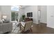 Bright living room with modern decor, hardwood floors, and large sliding doors to a balcony at 600 S Duke St # 24, Durham, NC 27701