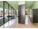 Modern building lobby with large windows, stylish seating, and polished concrete floors at 600 S Duke St # 24, Durham, NC 27701