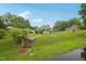 Quaint one-story home with a green lawn and mature trees at 620 Mcadams Rd, Hillsborough, NC 27278