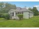 One-story home with a green lawn and quaint front porch at 620 Mcadams Rd, Hillsborough, NC 27278