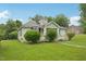 Side view of a cozy one-story home with an overgrown lawn at 620 Mcadams Rd, Hillsborough, NC 27278