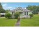 Charming one-story home with a quaint front porch and green lawn at 620 Mcadams Rd, Hillsborough, NC 27278