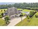 Expansive home with a three-car garage, swimming pool and cabana, and a basketball hoop at 6250 Moinear Ln, Chapel Hill, NC 27514