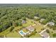 Aerial view of upscale neighborhood featuring well-manicured lawns and private swimming pools at 6250 Moinear Ln, Chapel Hill, NC 27514