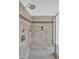 Close-up of bathroom shower featuring tile walls, built-in bench, and showerhead at 6250 Moinear Ln, Chapel Hill, NC 27514