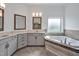 Bright bathroom features double vanity, soaking tub, and neutral color palette at 6250 Moinear Ln, Chapel Hill, NC 27514