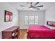 Bedroom with hardwood floors, a ceiling fan and plenty of natural light at 6250 Moinear Ln, Chapel Hill, NC 27514