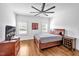 Bedroom with hardwood floors and a ceiling fan and plenty of natural light at 6250 Moinear Ln, Chapel Hill, NC 27514