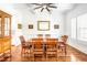 Dining room featuring coffered ceiling, wood floors, wainscoting, and large windows at 6250 Moinear Ln, Chapel Hill, NC 27514