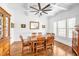 Dining room featuring coffered ceiling, wood floors, wainscoting, and large windows at 6250 Moinear Ln, Chapel Hill, NC 27514