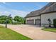 Three car garage with a basketball hoop and an electric car charger at 6250 Moinear Ln, Chapel Hill, NC 27514
