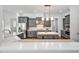 Modern kitchen featuring gray cabinets, stainless steel appliances, and a center island with pendant lighting at 6250 Moinear Ln, Chapel Hill, NC 27514