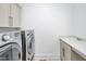 Laundry room featuring washer, dryer, sink, and plenty of storage at 6250 Moinear Ln, Chapel Hill, NC 27514