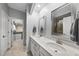 Bathroom with double vanity, walk-in closet, and glass shower at 6313 Kayton St, Raleigh, NC 27616