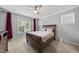 Bedroom with a large window, decorative bed frame, and ample natural light at 6313 Kayton St, Raleigh, NC 27616