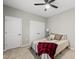 Bedroom featuring a ceiling fan, double closets, and cozy decor at 6313 Kayton St, Raleigh, NC 27616