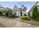 Charming single Gathering home with blue door, manicured landscaping, and a welcoming entrance at 6313 Kayton St, Raleigh, NC 27616