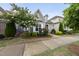 Charming home exterior with mature landscaping, flowering trees, and well-manicured lawn at 6313 Kayton St, Raleigh, NC 27616