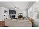 Inviting living room with a fireplace, built-in shelving, and a spacious sectional sofa at 6313 Kayton St, Raleigh, NC 27616