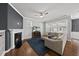 Cozy living room with a fireplace, hardwood floors, and a comfortable sectional sofa at 6313 Kayton St, Raleigh, NC 27616