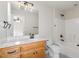 Cozy bathroom features single sink vanity with tile backsplash and tub at 6553 Vintage Ridge Ln, Fuquay Varina, NC 27526