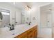 This bathroom has double sinks, vanity with cabinets, large mirror and light fixture above at 6553 Vintage Ridge Ln, Fuquay Varina, NC 27526