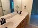 Well-lit bathroom with a double sink vanity, neutral color palette, and modern fixtures, perfect for a relaxing retreat at 6553 Vintage Ridge Ln, Fuquay Varina, NC 27526