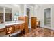 Spacious bathroom features double vanity, granite floors, and decorative columns at 6553 Vintage Ridge Ln, Fuquay Varina, NC 27526