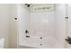This bathroom has a bathtub, shower head, and a window above it for natural light at 6553 Vintage Ridge Ln, Fuquay Varina, NC 27526