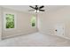 Bedroom featuring neutral carpet and two windows at 6553 Vintage Ridge Ln, Fuquay Varina, NC 27526