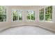 Bright breakfast nook with large windows offering views of the surrounding landscape at 6553 Vintage Ridge Ln, Fuquay Varina, NC 27526