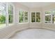 Bright breakfast nook with large windows offering views of the surrounding landscape at 6553 Vintage Ridge Ln, Fuquay Varina, NC 27526