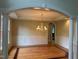 Elegant dining room with hardwood floors, decorative molding, and a chandelier at 6553 Vintage Ridge Ln, Fuquay Varina, NC 27526