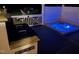 Outdoor space with a hot tub, kitchen and grilling area for entertaining at 6553 Vintage Ridge Ln, Fuquay Varina, NC 27526